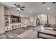 Spacious living room with a TV, ceiling fan, decorative cabinets, and arched entryway for easy flow at 451 Holly View Ln., Loris, SC 29569