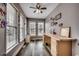 Bright home office with ample natural light, hardwood floors, and built-in desk space for a productive workspace at 451 Holly View Ln., Loris, SC 29569