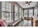 Bright sunroom featuring large windows, natural light, and modern flooring creating a versatile space at 451 Holly View Ln., Loris, SC 29569