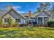 Lovely backyard with a brick patio, dining set, and lush green lawn at 4514 Wagon Run Circle, Murrells Inlet, SC 29576