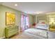 Cozy bedroom with a four-poster bed, soft carpet, and cheerful decor at 4514 Wagon Run Circle, Murrells Inlet, SC 29576