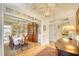 Elegant dining room with wallpaper, a large table, and built-in china cabinet at 4514 Wagon Run Circle, Murrells Inlet, SC 29576