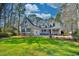 Charming two-story home with a covered front porch and well-manicured lawn at 4514 Wagon Run Circle, Murrells Inlet, SC 29576
