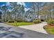 Charming gray two-story home with a manicured lawn and beautiful landscaping at 4514 Wagon Run Circle, Murrells Inlet, SC 29576