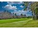 Scenic view of a lush green golf course on a sunny day at 4514 Wagon Run Circle, Murrells Inlet, SC 29576