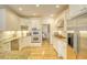 Well-lit kitchen featuring white cabinetry, granite countertops, and stainless steel appliances at 4514 Wagon Run Circle, Murrells Inlet, SC 29576