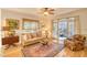 Cozy living room with natural light, hardwood floors, and comfortable seating arrangement at 4514 Wagon Run Circle, Murrells Inlet, SC 29576
