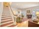 Inviting living room with hardwood floors, fireplace, and staircase, perfect for entertaining at 4514 Wagon Run Circle, Murrells Inlet, SC 29576