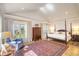 Serene main bedroom with a vaulted ceiling, large windows, and hardwood floors at 4514 Wagon Run Circle, Murrells Inlet, SC 29576