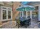 Brick patio with a dining set under a large umbrella at 4514 Wagon Run Circle, Murrells Inlet, SC 29576