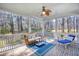 Inviting screened porch with comfortable furniture and a relaxing view of the outdoors at 4514 Wagon Run Circle, Murrells Inlet, SC 29576