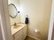 Charming half-bathroom featuring a stylish mirror, vanity, and fixtures, creating a functional and aesthetically pleasing space at 488 Greenview Dr. # 1, Johnsonville, SC 29555