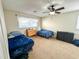 Bedroom features carpet, a ceiling fan, and bright windows offering ample natural light at 488 Greenview Dr. # 1, Johnsonville, SC 29555