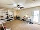 Versatile bedroom with built-in shelves, ceiling fan, and desk area, offering ample space for work and relaxation at 488 Greenview Dr. # 1, Johnsonville, SC 29555