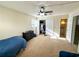 Bedroom features carpet, a ceiling fan, a bright window, and double door closet at 488 Greenview Dr. # 1, Johnsonville, SC 29555
