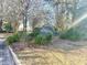 Welcoming entrance to The Dwellings community, framed by mature trees and blooming flowers at 488 Greenview Dr. # 1, Johnsonville, SC 29555