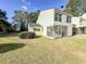 The home features a screened in patio and is surrounded by green grass and some bushes at 488 Greenview Dr. # 1, Johnsonville, SC 29555
