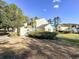 Exterior view of the yellow home with green bushes at 488 Greenview Dr. # 1, Johnsonville, SC 29555