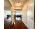 Inviting hallway showcasing hardwood floors and a glimpse into the spacious living room with a cozy seating arrangement at 488 Greenview Dr. # 1, Johnsonville, SC 29555