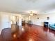 Spacious living room with wood floors, ceiling fan, and a view into the dining area at 488 Greenview Dr. # 1, Johnsonville, SC 29555