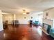 Bright living room featuring a fireplace, shiny wood floors, ceiling fan, and an open layout at 488 Greenview Dr. # 1, Johnsonville, SC 29555