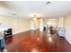 Spacious living room featuring shiny wood floors and an open layout to the dining area at 488 Greenview Dr. # 1, Johnsonville, SC 29555