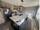 Modern kitchen featuring a marble island, stainless steel appliances, and light brown wooden cabinets at 495 N Green Sea Rd., Loris, SC 29569