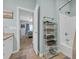 Bright bathroom featuring rack with stacked towels and an open doorway to a bedroom at 503 20Th Ave. N # 45D, North Myrtle Beach, SC 29582