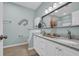 Bright bathroom featuring double vanity with granite countertop, stylish fixtures, and decor at 503 20Th Ave. N # 45D, North Myrtle Beach, SC 29582