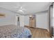 Bedroom featuring a ceiling fan, two closets, and a dresser with a wall-mounted TV at 503 20Th Ave. N # 45D, North Myrtle Beach, SC 29582