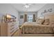 Comfortable bedroom featuring a large bed, dresser, and natural light from the window at 503 20Th Ave. N # 45D, North Myrtle Beach, SC 29582