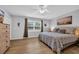 Bedroom featuring a ceiling fan, a large window, and a bed with an ornate, patterned comforter at 503 20Th Ave. N # 45D, North Myrtle Beach, SC 29582
