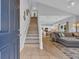 Open concept entryway with staircase, leading to a spacious living room and modern kitchen at 503 20Th Ave. N # 45D, North Myrtle Beach, SC 29582