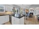 Bright and airy kitchen featuring white cabinets, modern appliances, and a view of the living room at 503 20Th Ave. N # 45D, North Myrtle Beach, SC 29582