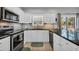Updated kitchen featuring stainless steel appliances, white cabinets, and granite countertops at 503 20Th Ave. N # 45D, North Myrtle Beach, SC 29582