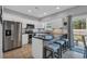 Modern kitchen with white cabinets, stainless steel appliances, and a breakfast bar with seating at 503 20Th Ave. N # 45D, North Myrtle Beach, SC 29582