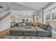 Bright and airy living room with a large sectional sofa and view of the kitchen at 503 20Th Ave. N # 45D, North Myrtle Beach, SC 29582