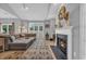 Bright living room with a fireplace, comfortable sectional sofa, and decorative elements at 503 20Th Ave. N # 45D, North Myrtle Beach, SC 29582