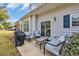 Cozy patio with cushioned seating, grill, and sliding glass doors offering seamless indoor-outdoor living at 503 20Th Ave. N # 45D, North Myrtle Beach, SC 29582
