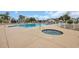Community pool and hot tub area featuring surrounding lounge area, ideal for relaxing and socializing at 503 20Th Ave. N # 45D, North Myrtle Beach, SC 29582