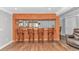 Basement bar area with counter seating, rich wood accents, and a mirrored backsplash at 510 21St Ave. N, North Myrtle Beach, SC 29582