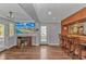 Finished basement area with bar, fireplace, television, and door to the backyard at 510 21St Ave. N, North Myrtle Beach, SC 29582
