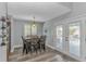Dining room with lots of light, wood floors and a French door to the outside at 510 21St Ave. N, North Myrtle Beach, SC 29582