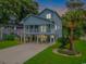This elevated home has a large porch and plenty of room for parking at 510 21St Ave. N, North Myrtle Beach, SC 29582