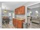 Transitional space with wood cabinets, granite countertops, and view into the dining and living rooms at 510 21St Ave. N, North Myrtle Beach, SC 29582