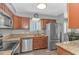 Bright kitchen with stainless steel appliances, hardwood floors, and a window overlooking the backyard at 510 21St Ave. N, North Myrtle Beach, SC 29582