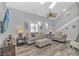 Bright living room with high ceilings, skylights, ceiling fan, comfortable seating, and modern decor at 510 21St Ave. N, North Myrtle Beach, SC 29582
