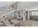 Open-concept living space showcasing modern flooring, staircase, comfortable seating, and connection to the dining area at 510 21St Ave. N, North Myrtle Beach, SC 29582