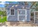 This backyard storage shed has a window and a front door decorated with a small American flag at 510 21St Ave. N, North Myrtle Beach, SC 29582