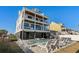 Stunning home featuring a private backyard pool, lounge chairs and multiple decks for outdoor relaxation at 5100 Ocean Blvd. N, North Myrtle Beach, SC 29582